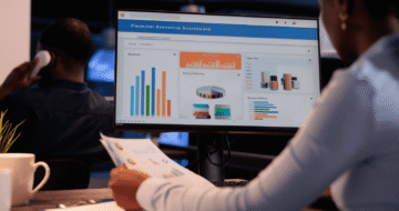 office-employee-analyzing-business-charts-computer-documents-looking-online-research-data-create-presentation-working-with-information-report-statistics-1